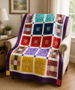 La Croce Fiorita throw quilt draped on a chair